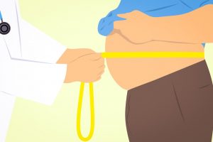 doctor-checking-weight-for-liposuction