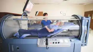 woman inside hyperbaric chamber